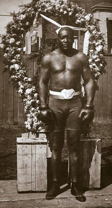 Jack Johnson, American boxer, 1910. Creator: Unknown