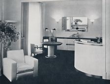 Jacques Adnet - Bar corner of a dining-room. The furniture is in polished black pearwood, black gla Artist: A. Salaun