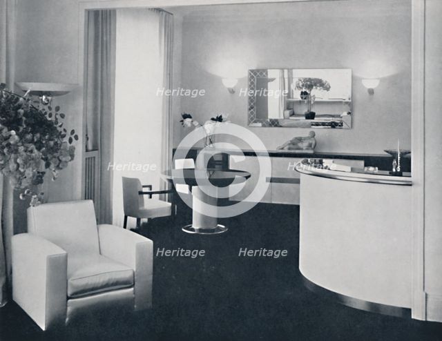 'Jacques Adnet - Bar corner of a dining-room. The furniture is in polished black pearwood, black gla Artist: A. Salaun.