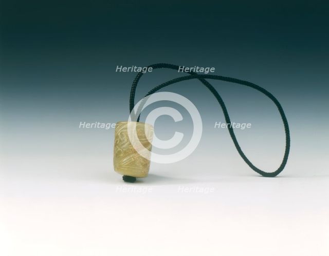 Jade bead with spiralling decoration, Western Zhou dynasty, China, c1100-771 BC. Creator: Unknown.