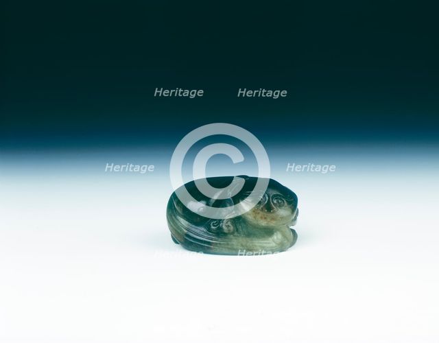 Jade cat sitting curled up scratching its ear with one eye closed, Yuan dynasty, China, 1279-1368. Artist: Unknown