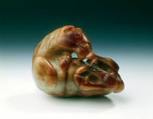 Jade horse with knotted tail biting its rear foot, Tang dynasty, China, 618-907