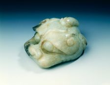 Jade one-horned monster head scroll weight, Yuan or Ming dynasty, China, 13th-16th century