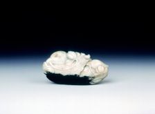 Jade pebble of two mandarin ducks on a bed of waves, late Ming dynasty, China, 1550-1644. Creator: Unknown