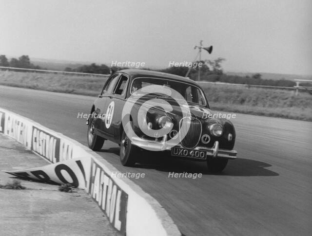 Jaguar 3.4 Mark1 J.W. Dean at Silverstone 1961. Creator: Unknown.