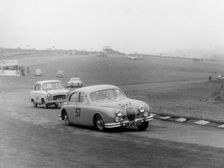 Jaguar 3.4 Mark1 at Brands Hatch 1957. Creator: Unknown