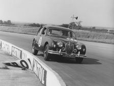 Jaguar 3.4 Mark1 J.W. Dean at Silverstone 1961. Creator: Unknown