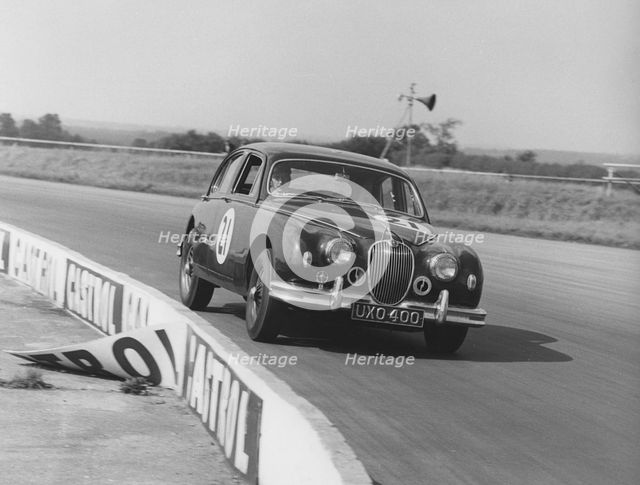 Jaguar 3.4 Mark1 J.W. Dean at Silverstone 1961. Creator: Unknown.