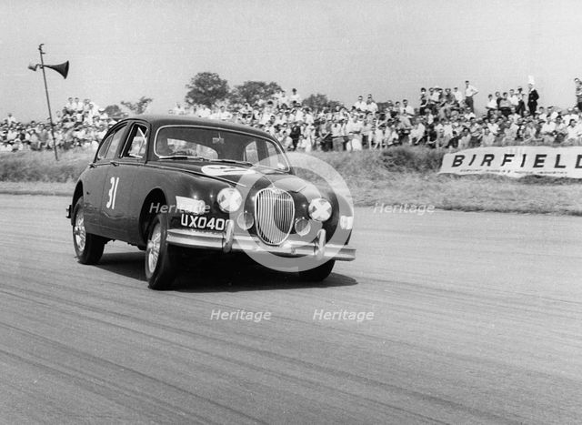 Jaguar Mk1 racing at Silverstone. Creator: Unknown.