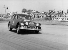 Jaguar Mk1 racing at Silverstone. Creator: Unknown