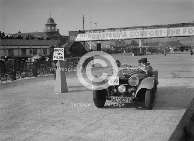 Jaguar SS 100 competing in the JCC Rally, Brooklands, Surrey, 1939. Artist: Bill Brunell.