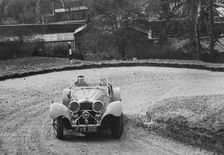 Jaguar SS 100 of CJ Gibson competing in the RAC Rally, 1939. Artist: Bill Brunell