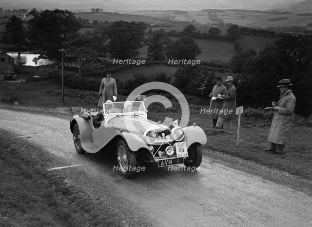 Jaguar SS 100 of Mrs V Hetherington competing in the South Wales Auto Club Welsh Rally, 1937 Artist: Bill Brunell.