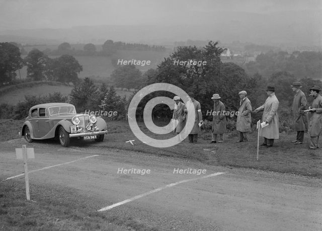 Jaguar SS saloon of BA Hickman competing in the South Wales Auto Club Welsh Rally, 1937 Artist: Bill Brunell.