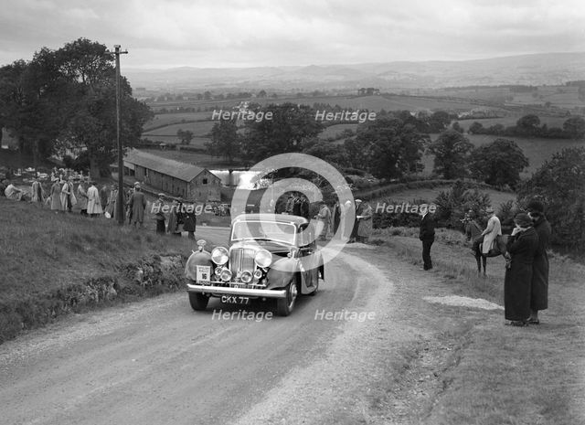 Jaguar SS saloon of DS Hand competing in the South Wales Auto Club Welsh Rally, 1937 Artist: Bill Brunell.