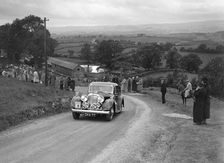 Jaguar SS saloon of DS Hand competing in the South Wales Auto Club Welsh Rally, 1937 Artist: Bill Brunell