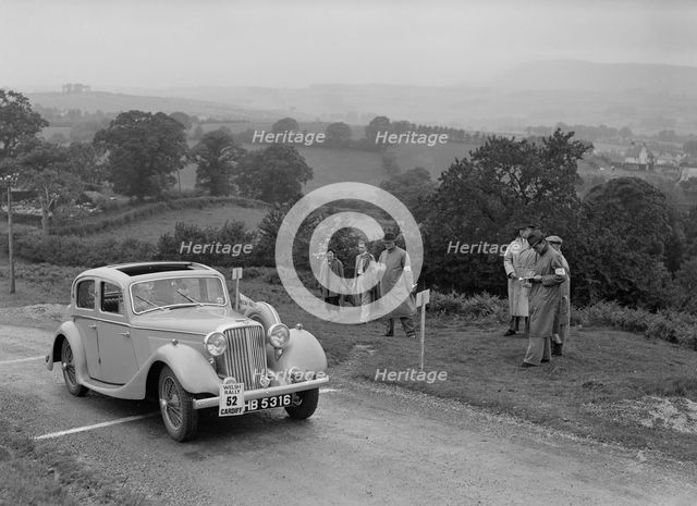 Jaguar SS saloon of N Howfield competing in the South Wales Auto Club Welsh Rally, 1937 Artist: Bill Brunell.