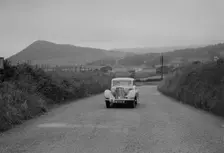 Jaguar SS saloon of N Howfield competing in the South Wales Auto Club Welsh Rally, 1937 Artist: Bill Brunell