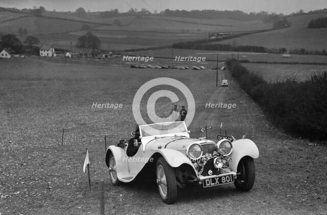 Jaguar SS100 at the Standard Car Owners Club Southern Counties Trial, 1938. Artist: Bill Brunell.