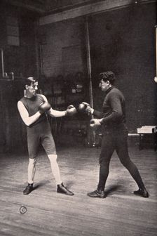 James J Corbett, American boxer, training with Jim Kennedy, 1900. Creator: Unknown