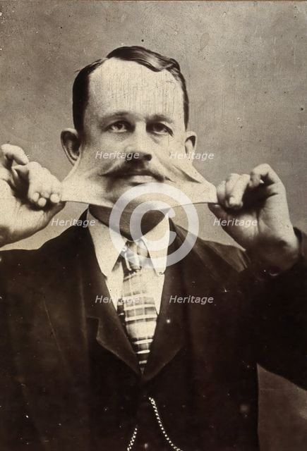 James Morris, stretching the skin on his face. Creator: Unknown.