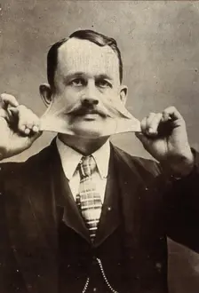 James Morris, stretching the skin on his face. Creator: Unknown