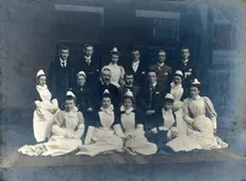 James Rutherford Morison with his staff: seven men and nine women, c1900. Creator: Unknown