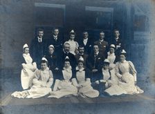 James Rutherford Morison with his staff: seven men and nine women, c1900. Creator: Unknown