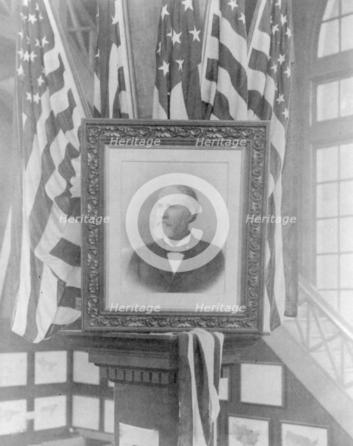 James Wilson, 1857-1932; photo of flag-decked framed bust portr. facing left, n.d.. Creator: Frances Benjamin Johnston.