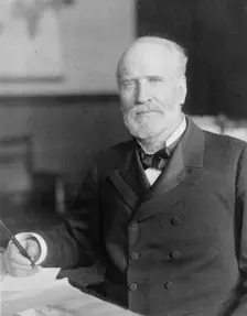 James Wilson, half-length portrait, seated at desk, facing slightly left, c1906. Creator: Frances Benjamin Johnston
