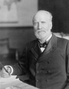 James Wilson, half-length portrait, seated at desk, facing slightly left, c1906. Creator: Frances Benjamin Johnston