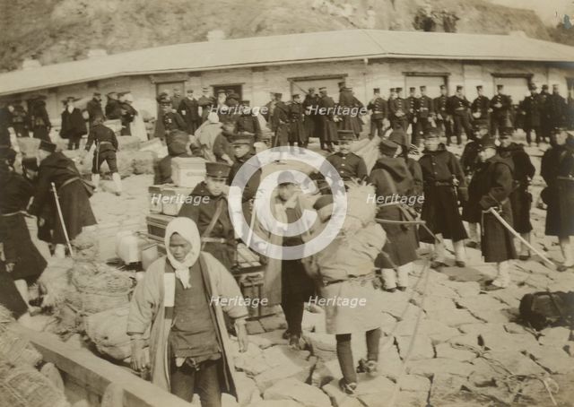Japanese cavalry troops watching over their supplies on the beach at Chemulpo, 1904. Creator: Robert Lee Dunn.