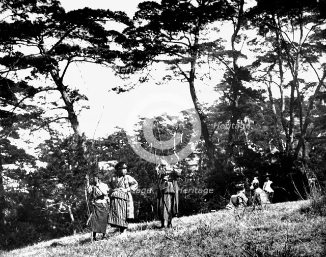 Japanese children playing with bows, Korea, 1900. Artist: Unknown
