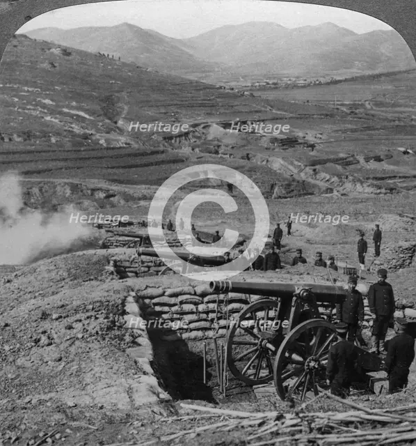 Japanese batteries firing on Russian forts, Siege of Port Arthur, Russo-Japanese War, 1904-1905.Artist: Underwood & Underwood