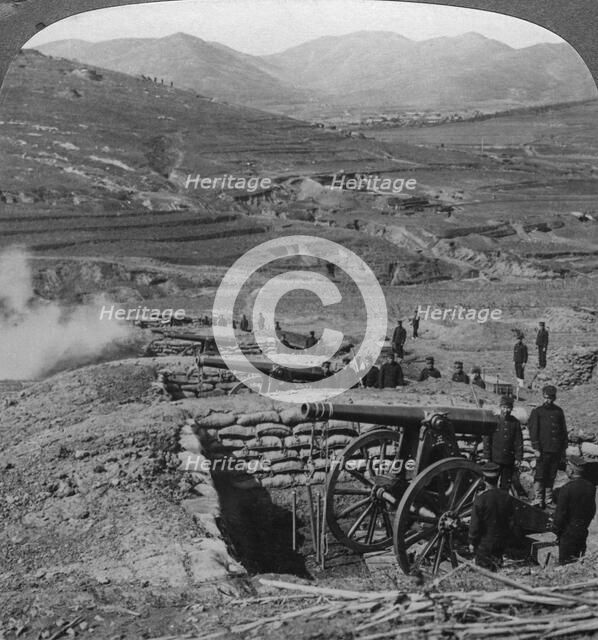 Japanese batteries firing on Russian forts, Siege of Port Arthur, Russo-Japanese War, 1904-1905.Artist: Underwood & Underwood