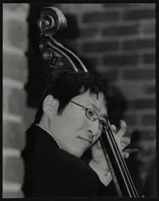 Japanese bassist Kengo Nakamura playing at The Fairway, Welwyn Garden City, Hertfordshire, 2004. Creator: Denis Williams