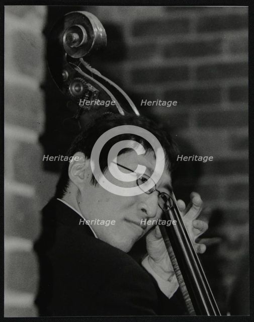 Japanese bassist Kengo Nakamura playing at The Fairway, Welwyn Garden City, Hertfordshire, 2004. Artist: Denis Williams