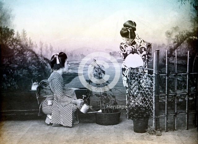 Japanese girls playing in a garden, 1880. Creator: Unknown.
