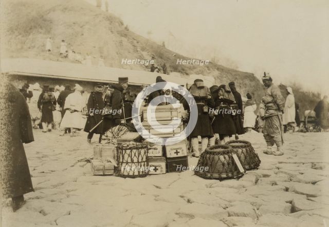 Japanese Hospital Corps landing medical and surgical supplies at Chemulpo, c1904. Creator: Robert Lee Dunn.