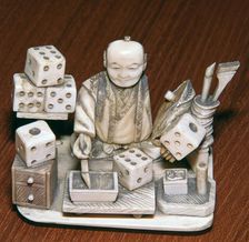 Japanese ivory of a dice painter, 19th century