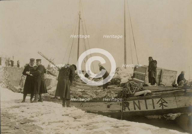 Japanese officers directing the unloading of supplies, Chemulpo, c1904. Creator: Robert Lee Dunn.
