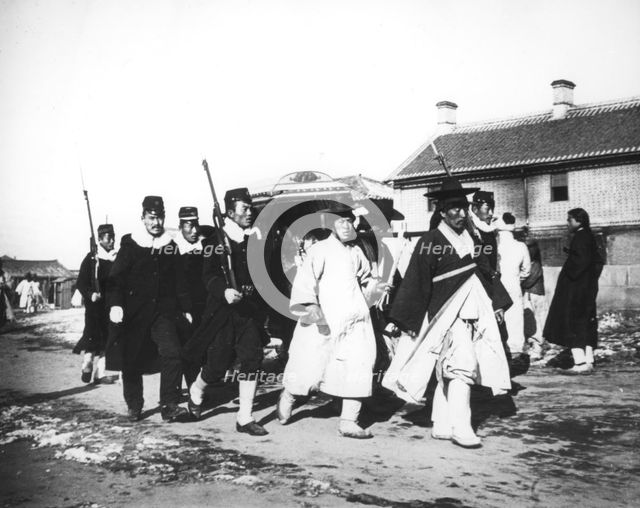 Japanese official with an escort of soldiers, Korea, c1900. Artist: Unknown