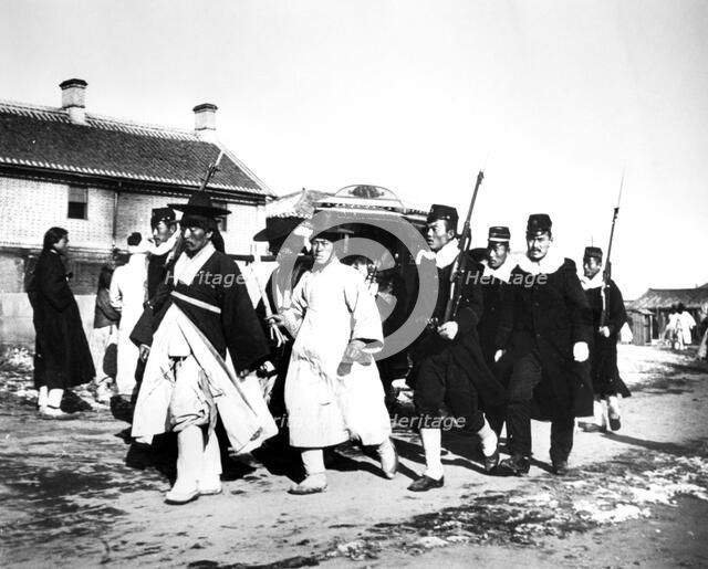 Japanese officials and soldiers, Korea, 1900. Artist: Unknown