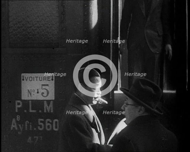 Japanese League of Nations Delegate Walking Past a Train, 1933. Creator: British Pathe Ltd.