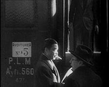 Japanese League of Nations Delegate Walking Past a Train, 1933. Creator: British Pathe Ltd