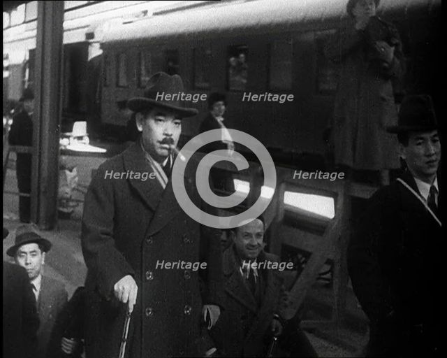 Japanese League of Nations Delegates Entering a Train Station, 1933. Creator: British Pathe Ltd.