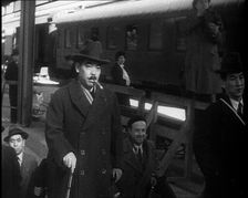 Japanese League of Nations Delegates Entering a Train Station, 1933. Creator: British Pathe Ltd