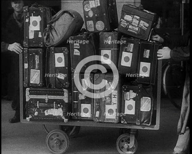 Japanese Luggage Being Wheeled Away, 1933. Creator: British Pathe Ltd.