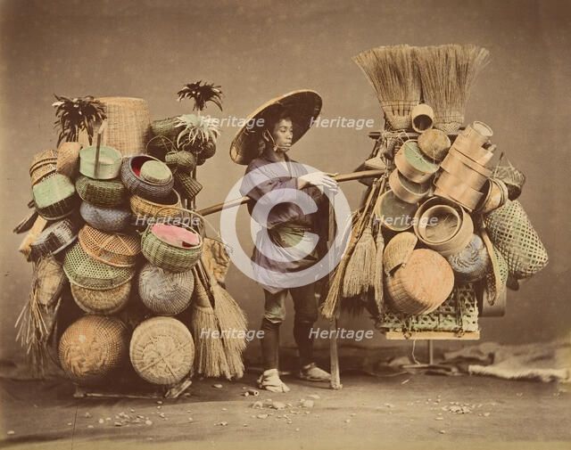 [Japanese Man Posing with Baskets, Brooms and Feather Dusters], 1870s. Creator: Unknown.