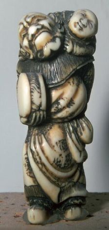 Japanese Netsuke of a Chinese dancer and child, 18th century. Artist: Masahira
